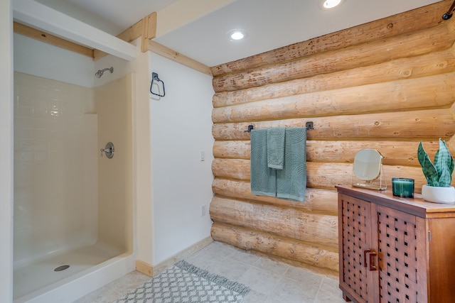 bathroom featuring walk in shower and tile patterned flooring