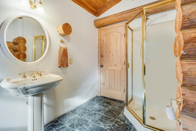 1750 Hill Meadows Rd, Whitefish, MT 59937 - bathroom with marble look tiles, lofted ceiling, a stall shower, and wood ceiling