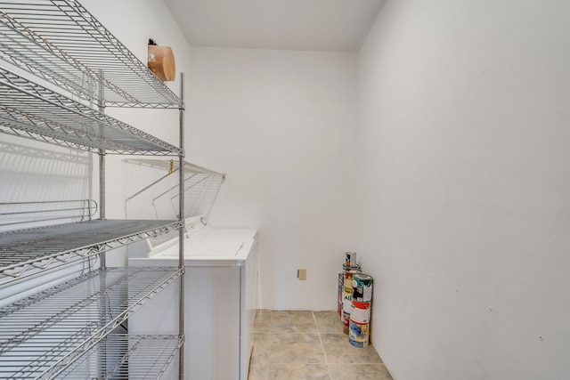 laundry room with washing machine and clothes dryer