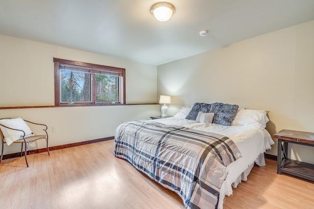 bedroom with light hardwood / wood-style flooring