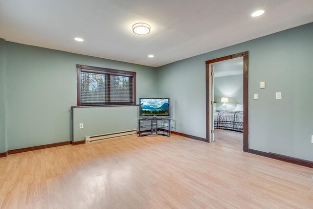 1750 Hill Meadows Rd, Whitefish, MT 59937 - living room featuring baseboard heating, light wood-style floors, baseboards, and recessed lighting