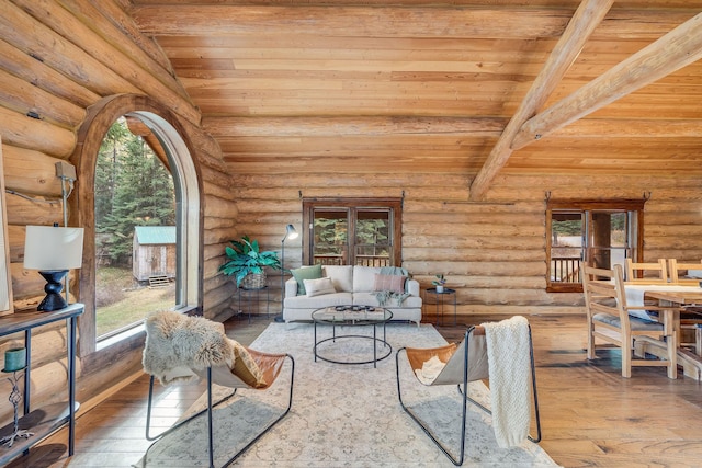 living room with hardwood / wood-style flooring, a wealth of natural light, and wood ceiling