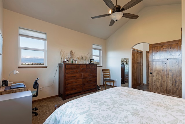 bedroom with carpet flooring, high vaulted ceiling, and ceiling fan