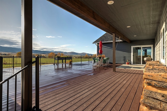 wooden deck with a mountain view