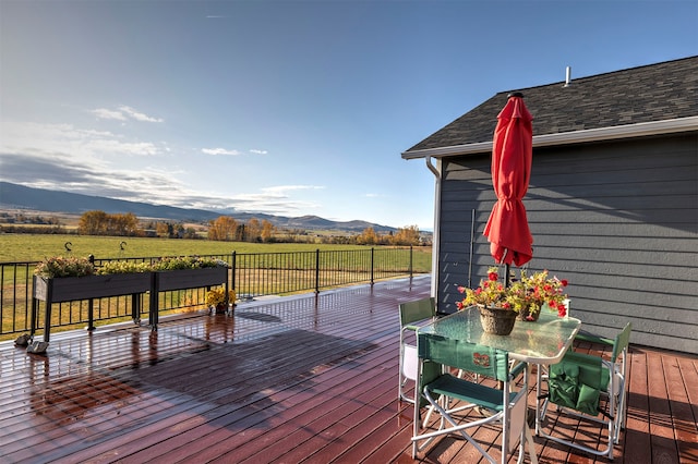 wooden terrace featuring a mountain view and a rural view