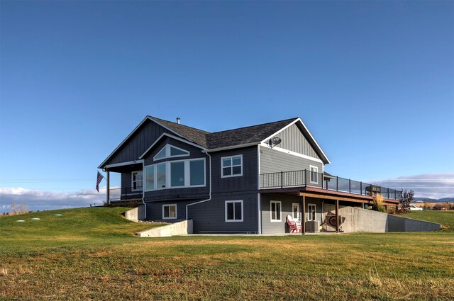 rear view of property featuring a wooden deck, a yard, and central AC unit