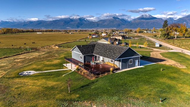 birds eye view of property featuring a mountain view and a rural view