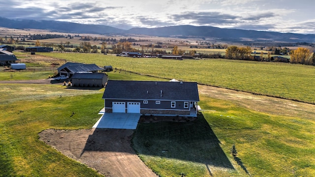 bird's eye view with a mountain view and a rural view