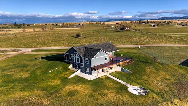 drone / aerial view with a rural view and a mountain view