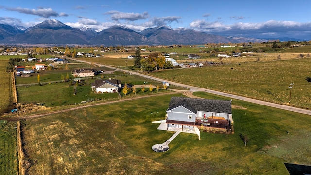 drone / aerial view featuring a mountain view and a rural view