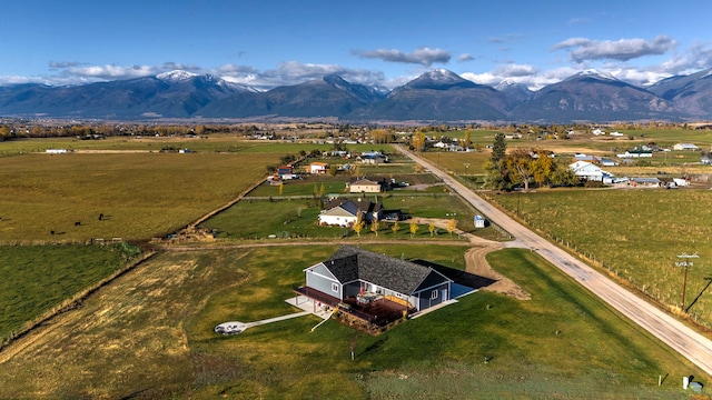 drone / aerial view featuring a mountain view and a rural view