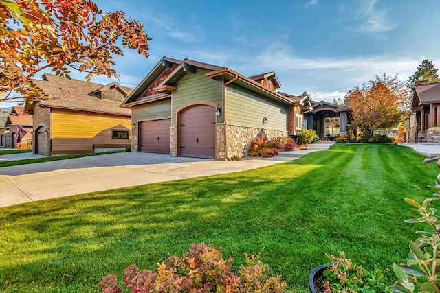 view of front of house with a front lawn and a garage