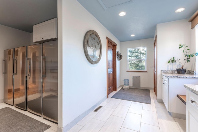 bathroom featuring vanity and tile patterned flooring