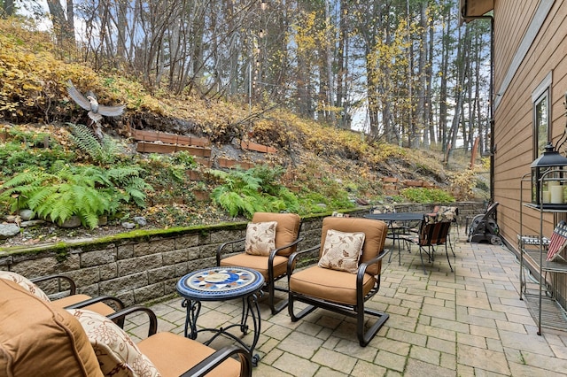 view of patio / terrace with an outdoor fire pit