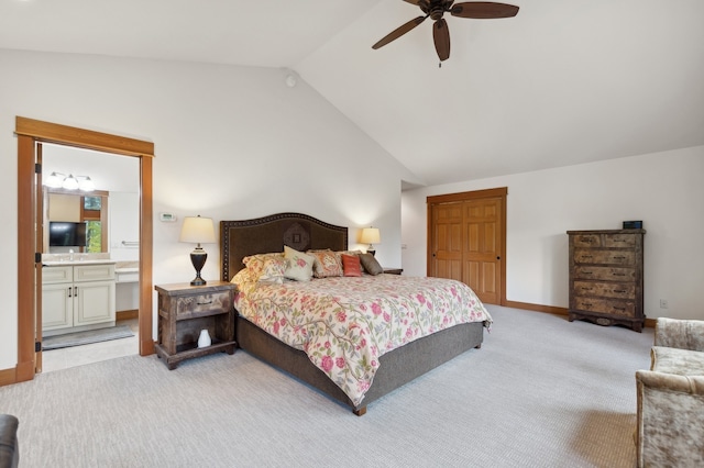 bedroom featuring vaulted ceiling, carpet flooring, ceiling fan, and ensuite bathroom