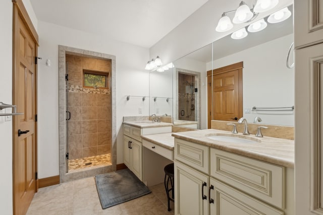 bathroom with walk in shower, vanity, and tile patterned floors