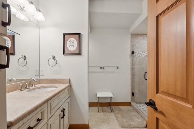 bathroom featuring tile patterned flooring, vanity, and an enclosed shower