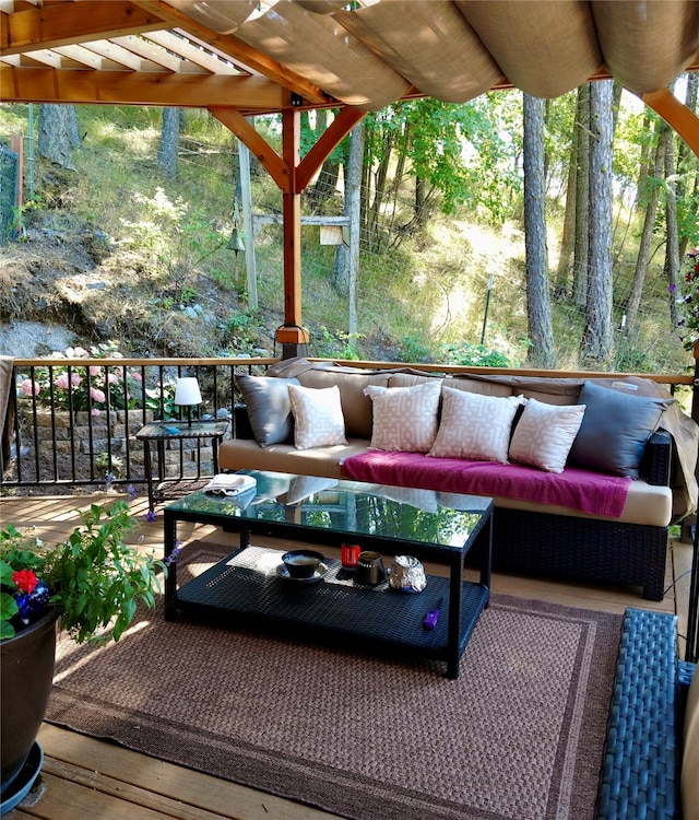 deck featuring outdoor lounge area and a pergola