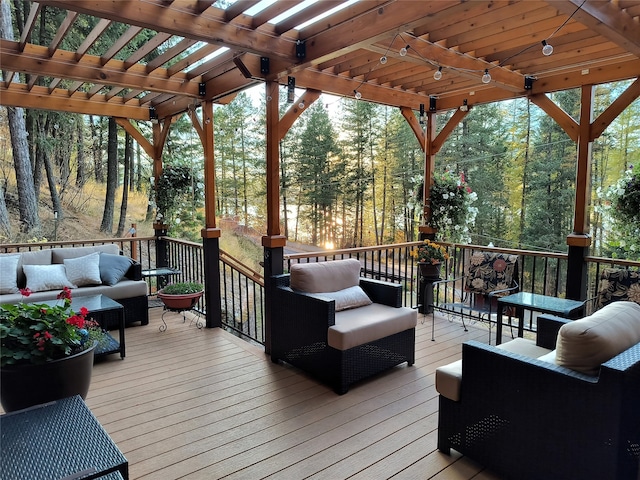 wooden terrace featuring a pergola and an outdoor hangout area