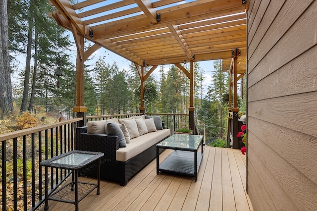 deck featuring a pergola and an outdoor living space