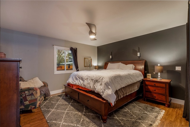 bedroom featuring dark hardwood / wood-style floors and ceiling fan