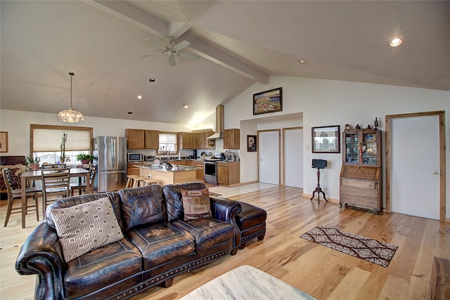 living room featuring beam ceiling, ceiling fan with notable chandelier, high vaulted ceiling, and light hardwood / wood-style flooring