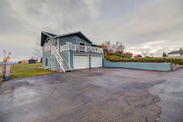 view of home's exterior featuring a yard and a garage