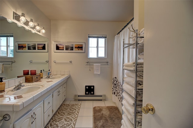 bathroom featuring tile patterned floors, vanity, and baseboard heating