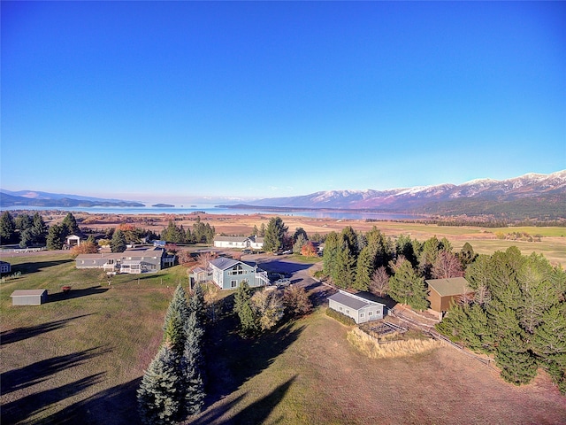 birds eye view of property with a mountain view