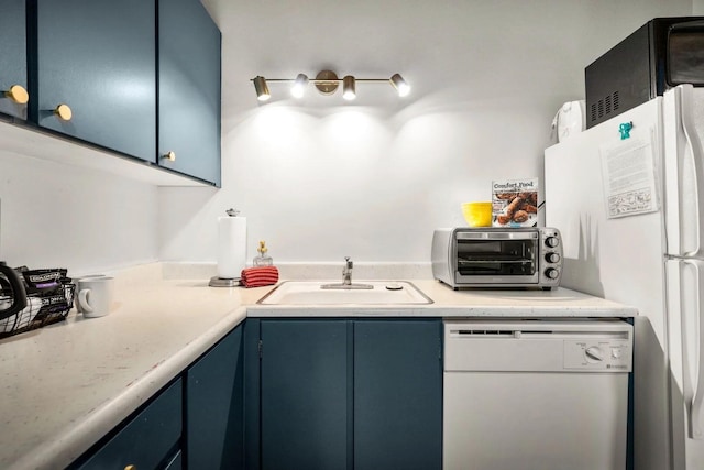 45 Alder Way Unit 3C, Whitefish, MT 59937 - kitchen with white dishwasher, a sink, blue cabinets, and light countertops