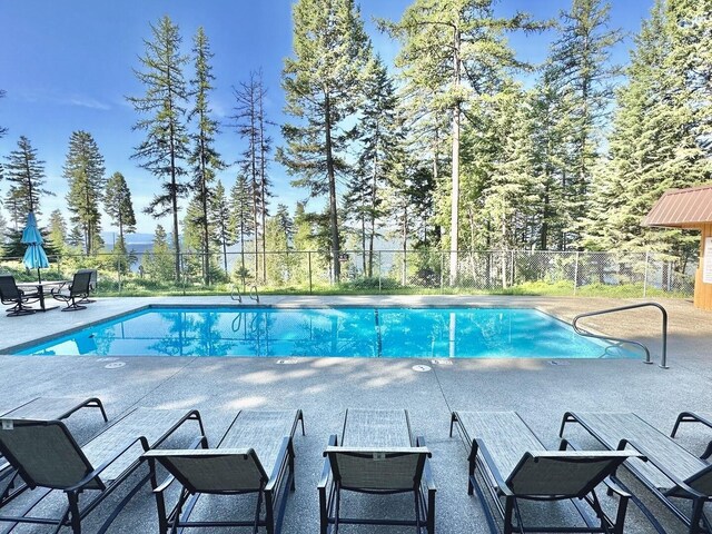45 Alder Way Unit 3C, Whitefish, MT 59937 - view of swimming pool with a patio area and fence