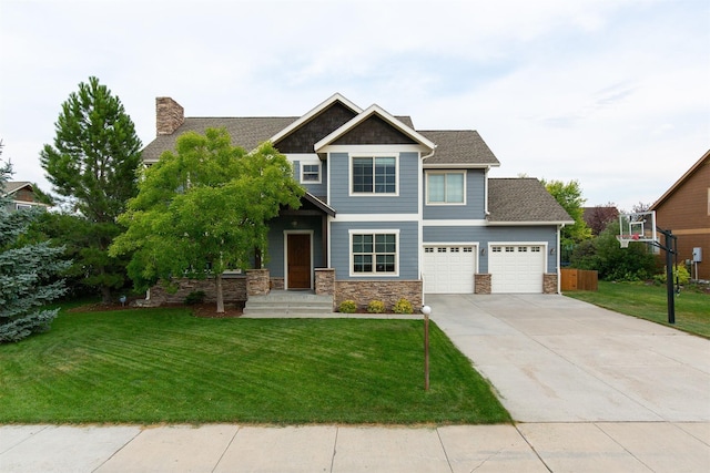 view of front of home featuring a front yard and a garage