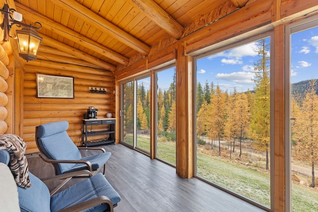 2197 W Tower Rd, Saltese, MT 59867 - sunroom with wooden ceiling, wood finished floors, rustic walls, and a forest view