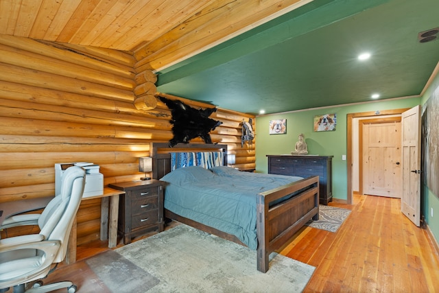 2197 W Tower Rd, Saltese, MT 59867 - bedroom with log walls, wood-type flooring, recessed lighting, and baseboards