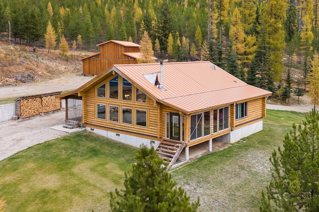 2197 W Tower Rd, Saltese, MT 59867 - rear view of house with log siding, a view of trees, a lawn, and crawl space