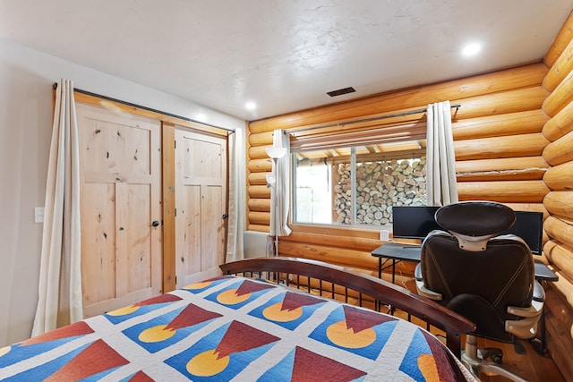 2197 W Tower Rd, Saltese, MT 59867 - bedroom featuring rustic walls and recessed lighting