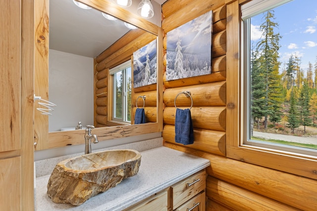 2197 W Tower Rd, Saltese, MT 59867 - bathroom with log walls and vanity