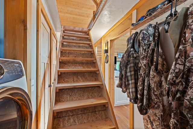 2197 W Tower Rd, Saltese, MT 59867 - stairway featuring washer / clothes dryer and wood finished floors