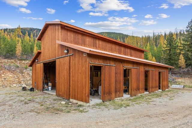 2197 W Tower Rd, Saltese, MT 59867 - garage featuring a forest view