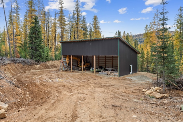 2197 W Tower Rd, Saltese, MT 59867 - view of pole building featuring a forest view