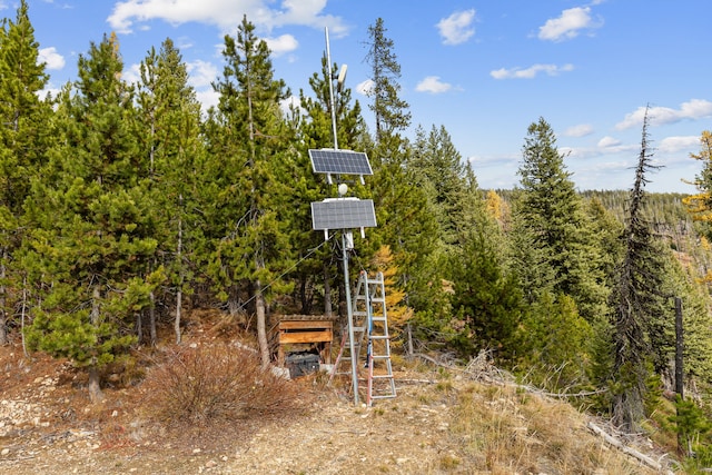2197 W Tower Rd, Saltese, MT 59867 - exterior space featuring solar panels and a wooded view