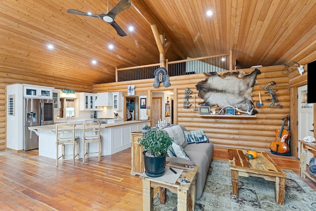 2197 W Tower Rd, Saltese, MT 59867 - living room featuring wood ceiling, a ceiling fan, light wood-style flooring, recessed lighting, and rustic walls