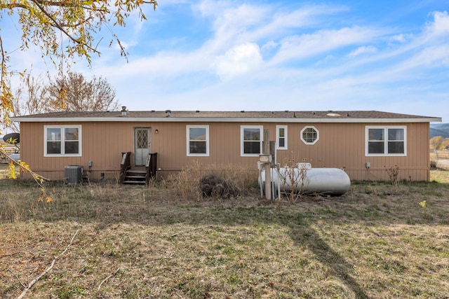 rear view of house with cooling unit