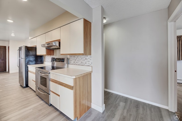 kitchen with backsplash, white cabinetry, a textured ceiling, light hardwood / wood-style flooring, and stainless steel appliances