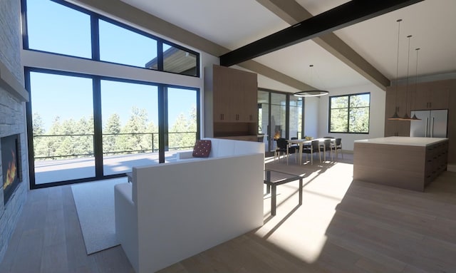 living room with a fireplace, beamed ceiling, hardwood / wood-style floors, and high vaulted ceiling