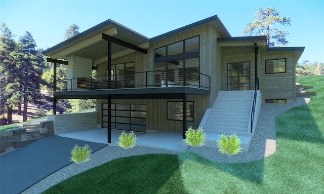 448 Highline Ct, Whitefish, MT 59937 - back of house with stairway, driveway, a balcony, and a patio
