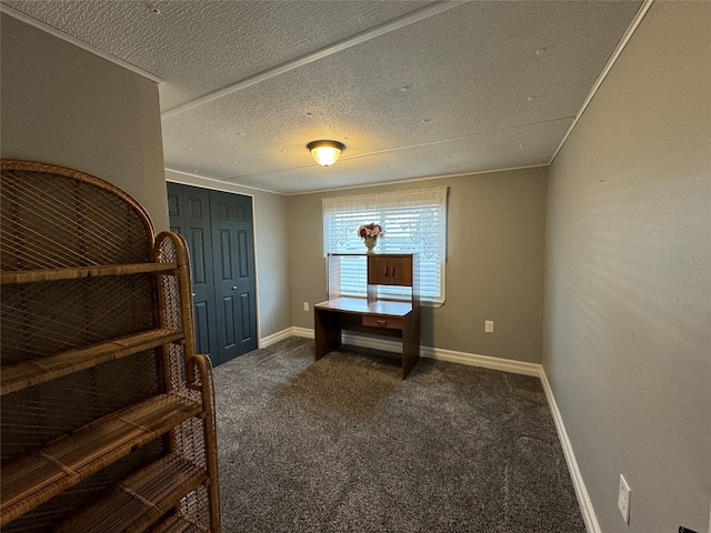 office space featuring a textured ceiling and dark colored carpet