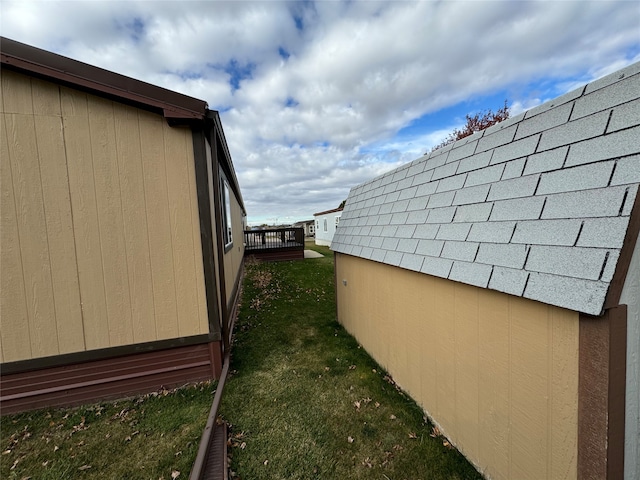 view of side of property with a lawn