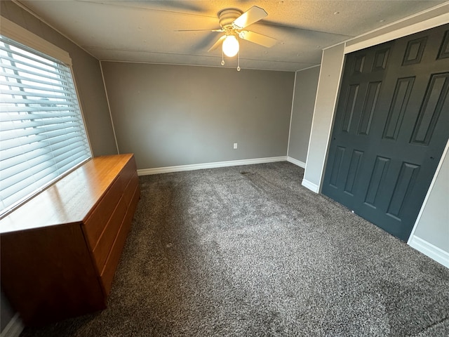 interior space featuring a textured ceiling and ceiling fan