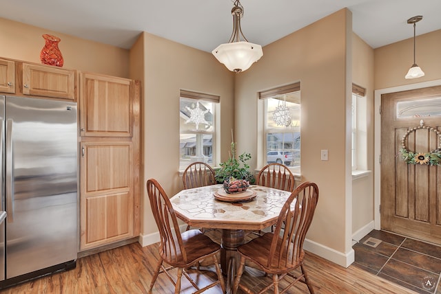 dining space featuring wood-type flooring